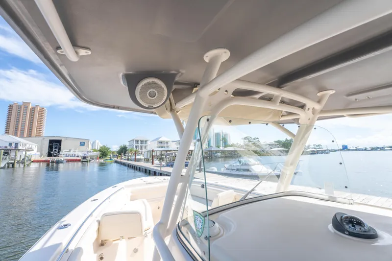 Slide: The Image of 2017 Grady-White 336 Canyon boat docked at marina with clear sky. - 36