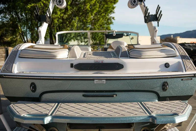 Slide: The Image of 2021 MB B23 Alpha boat, rear view, featuring sleek design and modern amenities. - 11