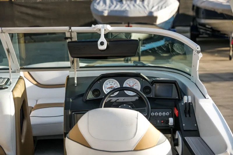 Slide: The Image of Interior of a 2021 MB B23 Alpha boat, featuring dashboard and steering wheel. - 15