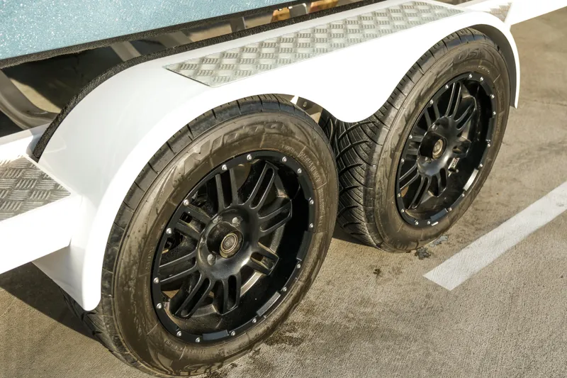 Slide: The Image of Close-up of black wheels on a 2021 MB B23 Alpha trailer. - 19