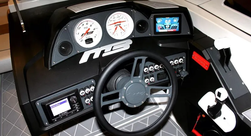 Slide: The Image of Dashboard of 2021 MB B23 Alpha boat with steering wheel and control panel. - 3
