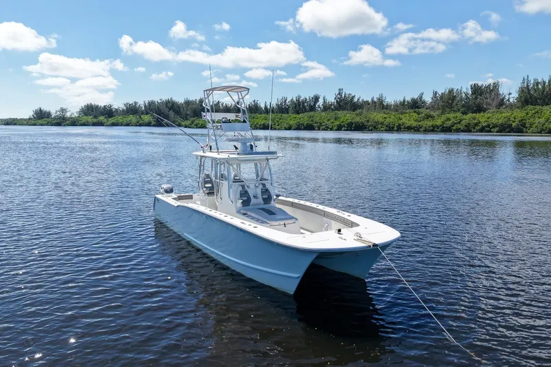 Slide: The Image of 2020 Tideline 365 Offshore boat on calm water under blue sky. - 5