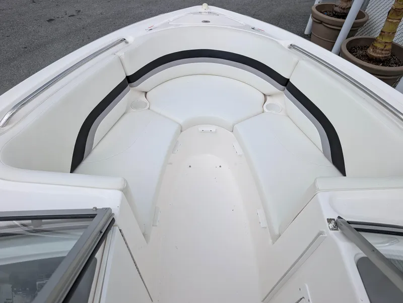 Slide: The Image of 2004 Yamaha Boats AR230 HO bow seating area with white and black upholstery. - 12