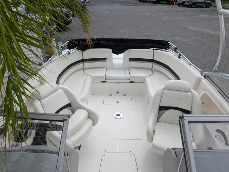 Slide: The Image of 2004 Yamaha Boats AR230 HO interior with white seating and spacious layout. - 13