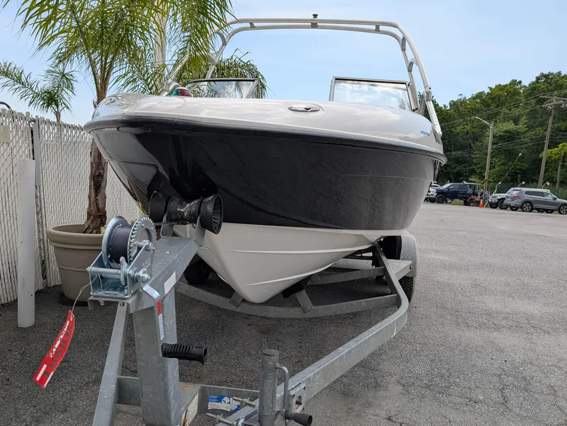 Slide: The Image of 2004 Yamaha Boats AR230 HO on trailer, parked outdoors near palm trees. - 3