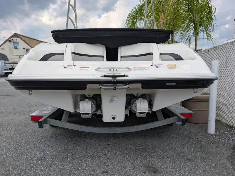 Slide: The Image of 2004 Yamaha Boats AR230 HO on trailer, rear view, parked outdoors. - 7