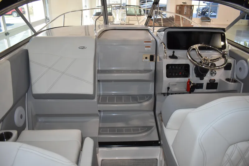 Slide: The Image of 2026 Regal 26 XO boat interior with modern helm and seating. - 19