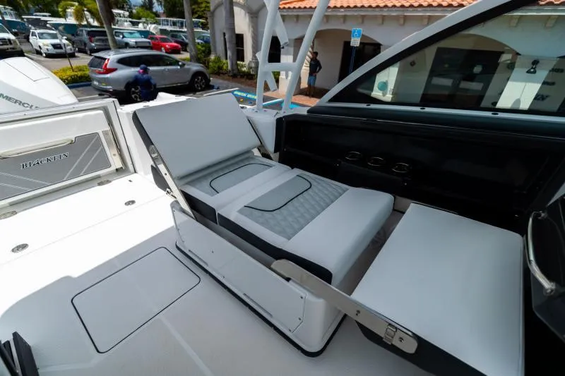 Slide: The Image of 2025 Blackfin 252 DC boat interior with adjustable seating and modern design. - 10