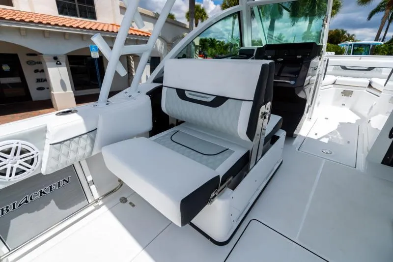 Slide: The Image of 2025 Blackfin 252 DC boat interior with white and black seating. - 11