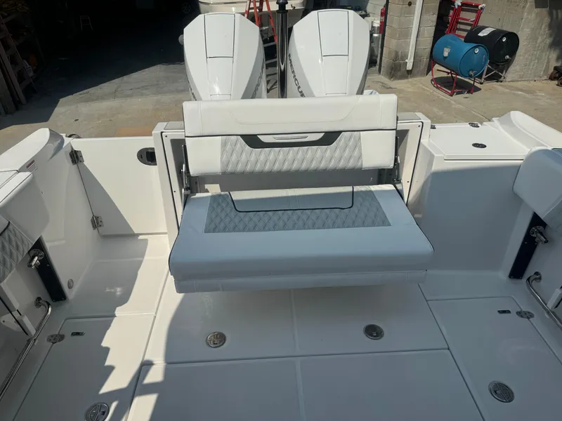 Slide: The Image of 2025 Blackfin 252 DC boat with dual outboard engines and foldable rear seating. - 13