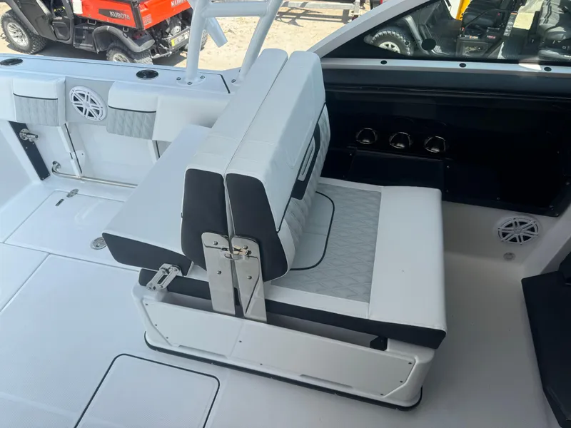 Slide: The Image of 2025 Blackfin 252 DC boat interior seating and deck area. - 16