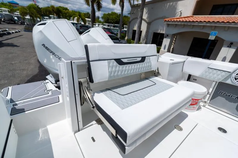 Slide: The Image of 2025 Blackfin 252 DC boat with Mercury engines and foldable seating. - 19