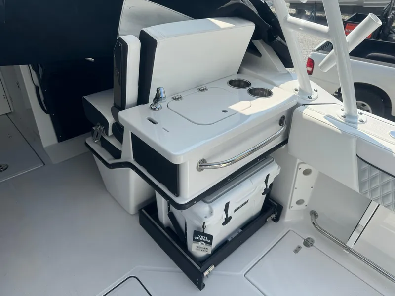 Slide: The Image of 2025 Blackfin 252 DC boat interior with seating and storage compartments. - 21