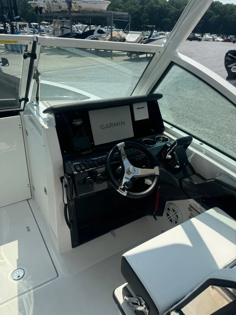 Slide: The Image of 2025 Blackfin 252 DC boat cockpit with Garmin navigation system. - 26