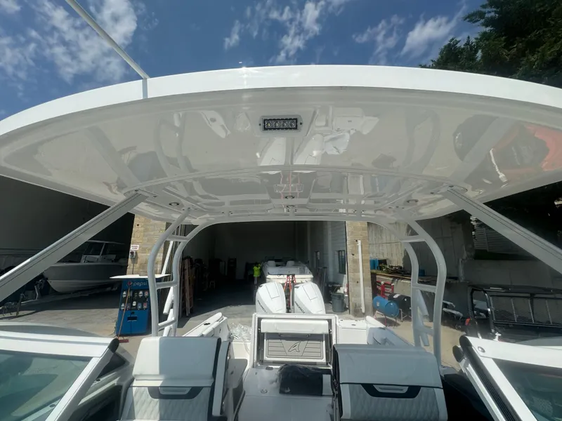 Slide: The Image of 2025 Blackfin 252 DC boat interior with hardtop and seating. - 27