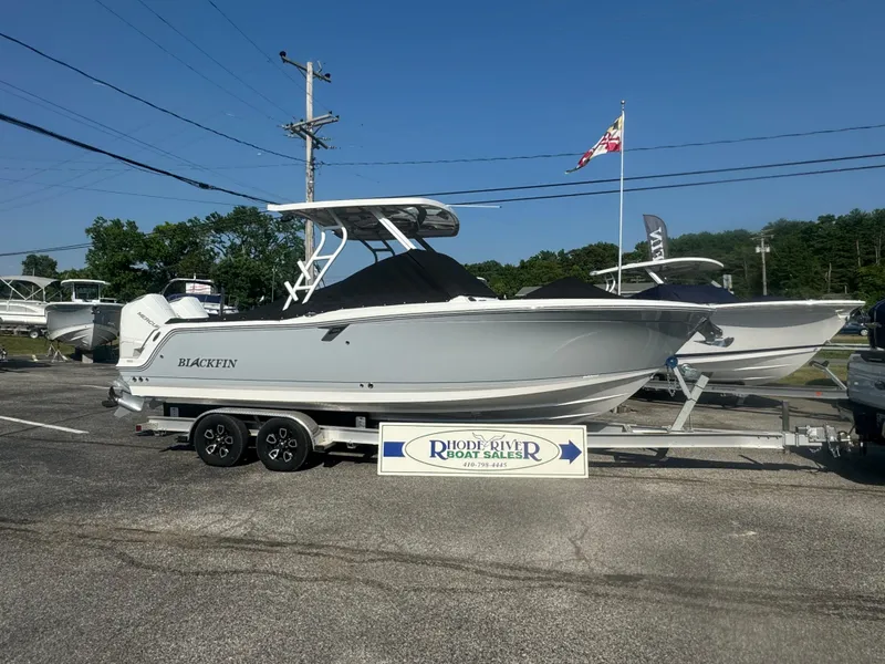Slide: The Image of 2025 Blackfin 252 DC boat on a trailer at a dealership. - 3