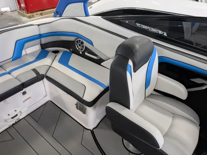 Slide: The Image of 2019 Yamaha Boats 242X E-Series interior with blue and white seating, modern design. - 15