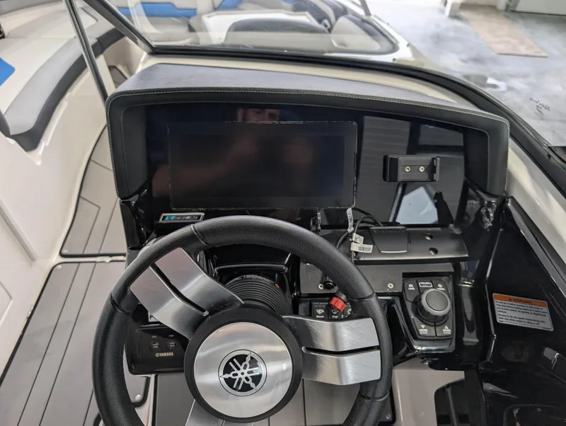 Slide: The Image of 2019 Yamaha Boats 242X E-Series dashboard with steering wheel and control panel. - 20