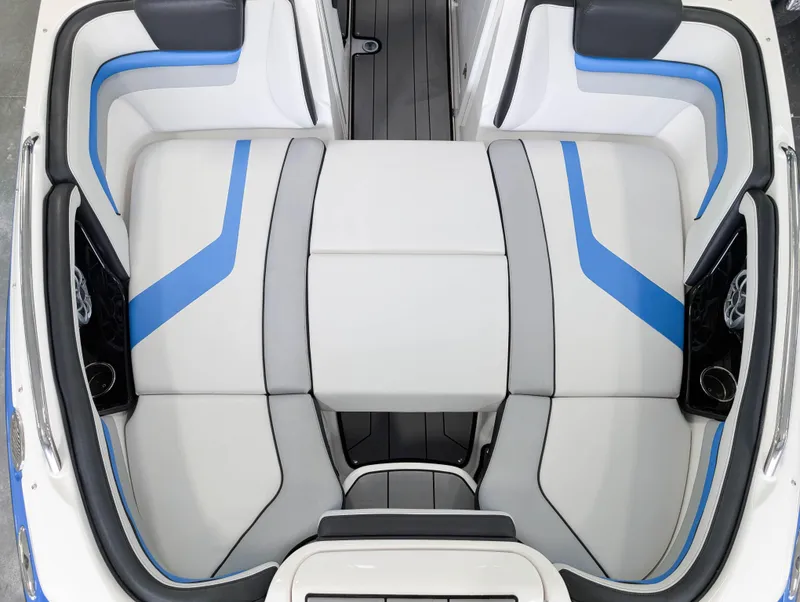 Slide: The Image of 2019 Yamaha Boats 242X E-Series interior with blue and gray seating design. - 23