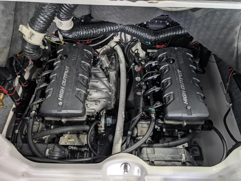 Slide: The Image of 2019 Yamaha Boats 242X E-Series engine compartment with dual high-output engines. - 29