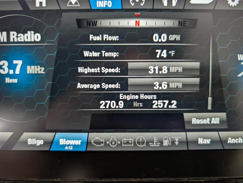 Slide: The Image of Dashboard of 2019 Yamaha Boats 242X E-Series showing speed, engine hours, and water temperature. - 32