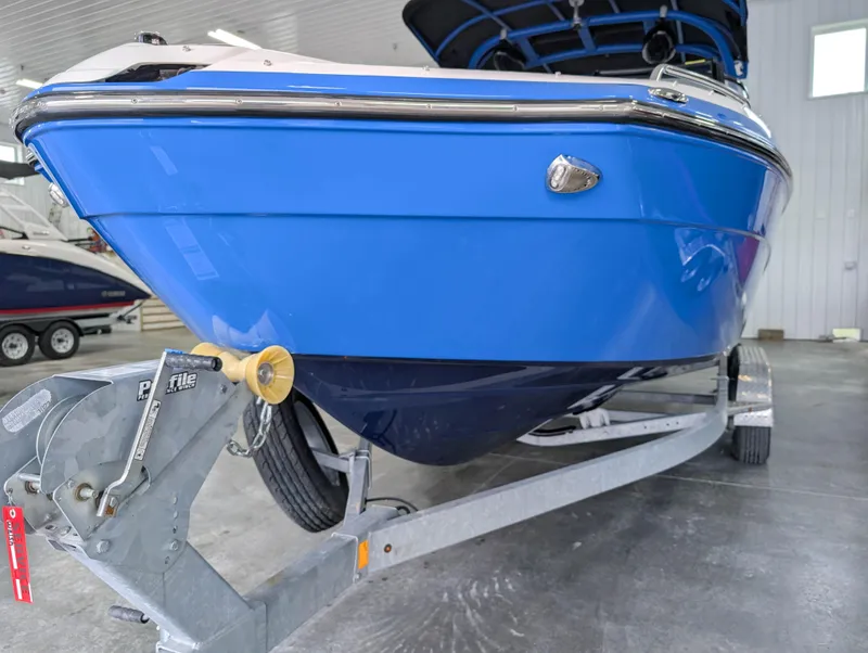 Slide: The Image of 2019 Yamaha Boats 242X E-Series on trailer in indoor storage. - 4