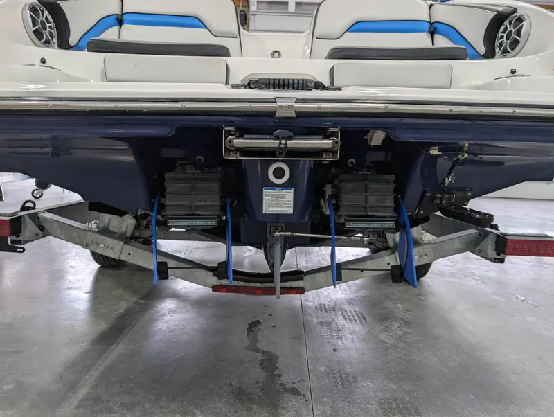 Slide: The Image of 2019 Yamaha Boats 242X E-Series rear view, showcasing dual engines and seating. - 9