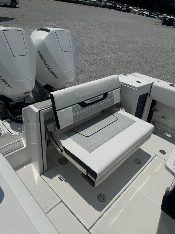 Slide: The Image of 2025 Blackfin 272 CC boat with dual Mercury engines and foldable seating. - 15