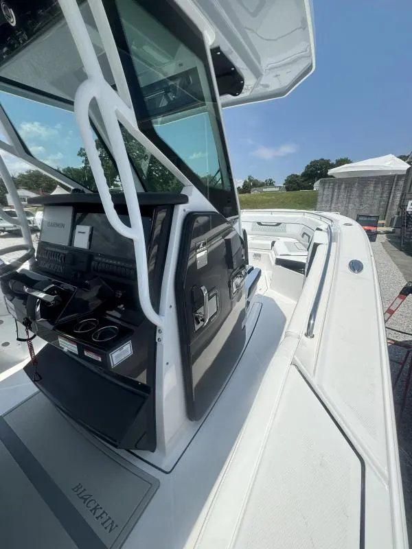 Slide: The Image of 2025 Blackfin 272 CC boat with sleek console and modern design. - 17