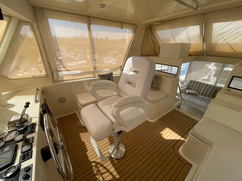 Slide: The Image of 2005 Novatec 48 Cockpit Motor Yacht interior with captain's chair and control panel. - 12