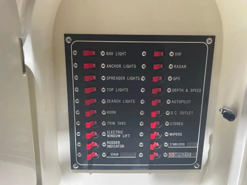 Slide: The Image of Control panel of a 2005 Novatec 48 Cockpit Motor Yacht with labeled switches. - 18