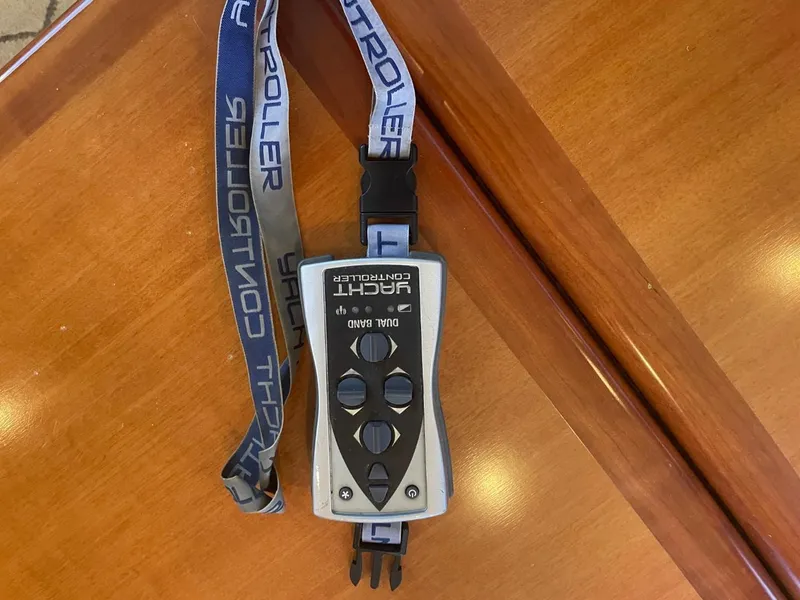 Slide: The Image of Remote control for Novatec 48 Cockpit Motor Yacht, 2005, on wooden surface. - 19