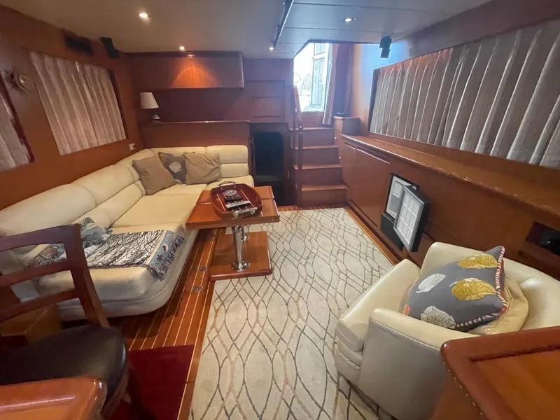 Slide: The Image of Luxurious interior of 2005 Novatec 48 Cockpit Motor Yacht with elegant seating and decor. - 22