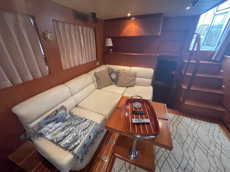 Slide: The Image of Luxurious interior of 2005 Novatec 48 Cockpit Motor Yacht with cozy seating and elegant decor. - 23