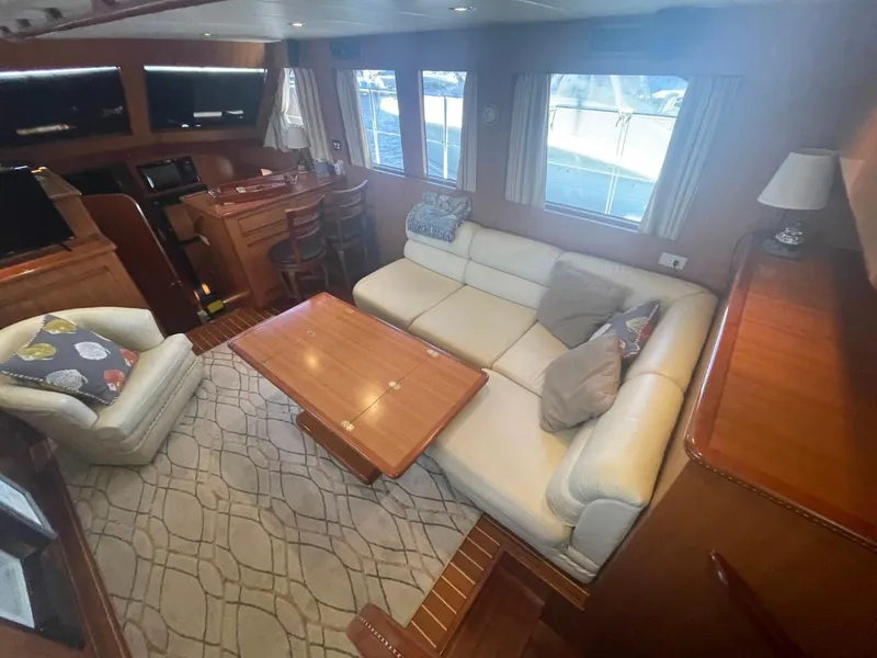 Slide: The Image of Luxurious interior of 2005 Novatec 48 Cockpit Motor Yacht with plush seating and elegant decor. - 26