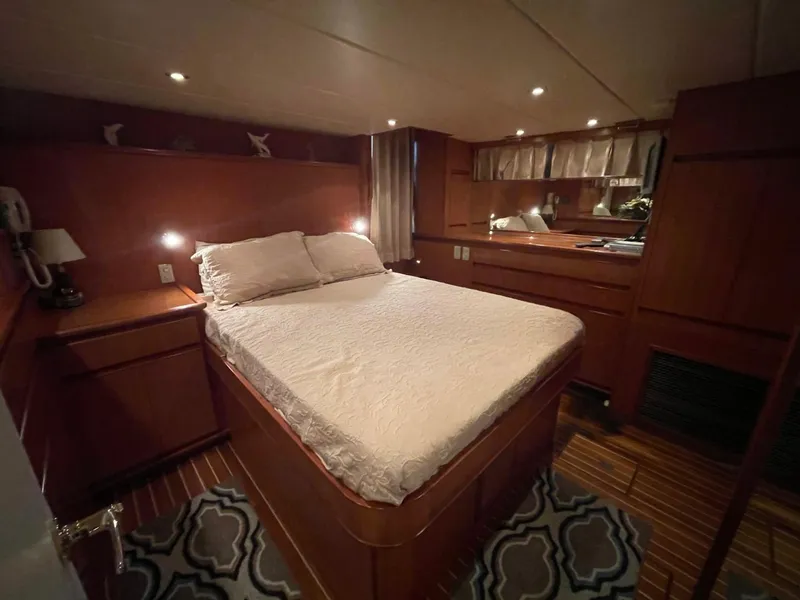 Slide: The Image of Luxurious bedroom interior of 2005 Novatec 48 Cockpit Motor Yacht with wood paneling. - 29