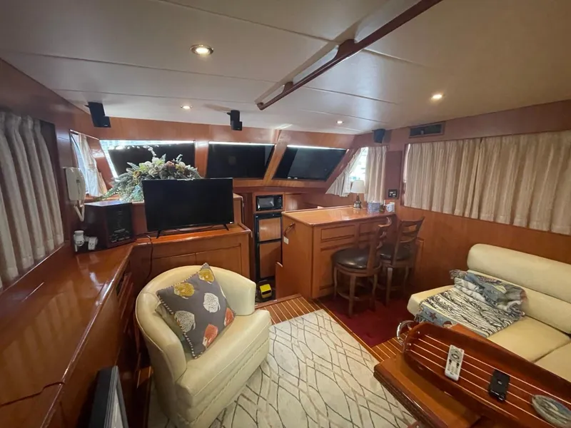 Slide: The Image of Luxurious 2005 Novatec 48 Cockpit Motor Yacht interior with cozy seating and elegant decor. - 30
