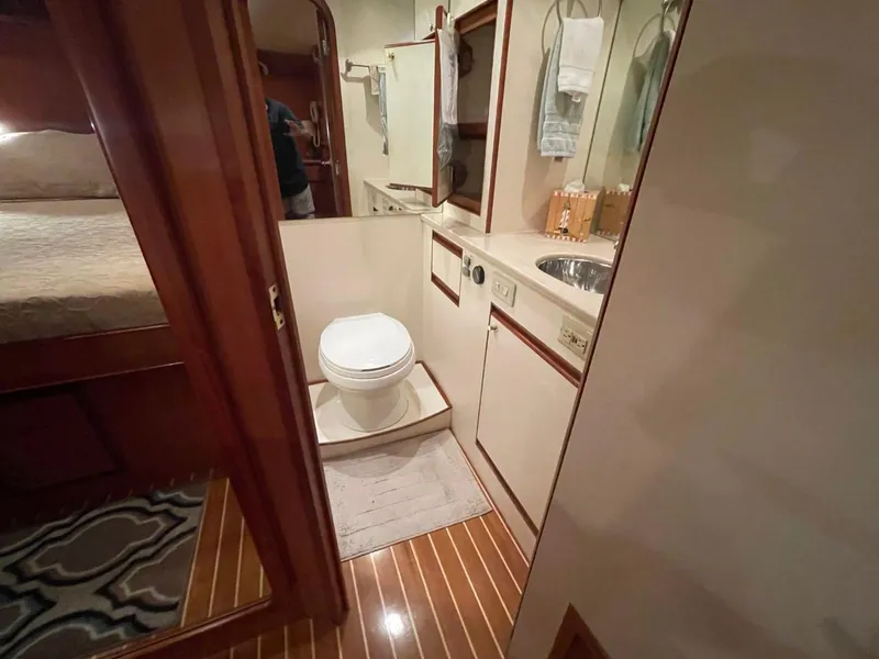 Slide: The Image of Bathroom interior of 2005 Novatec 48 Cockpit Motor Yacht with wooden flooring. - 34