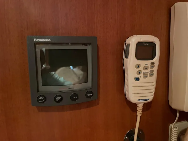 Slide: The Image of Raymarine display and Icom radio on 2005 Novatec 48 Cockpit Motor Yacht dashboard. - 39