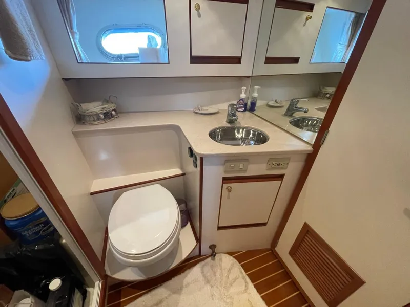 Slide: The Image of 2005 Novatec 48 Cockpit Motor Yacht bathroom with sink, toilet, and mirror. - 40