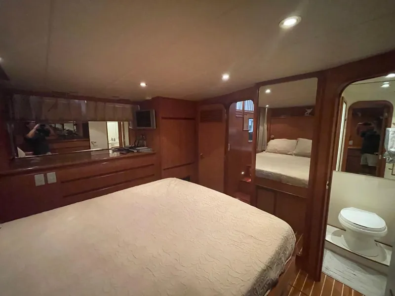 Slide: The Image of Luxurious bedroom interior of 2005 Novatec 48 Cockpit Motor Yacht with wood finishes. - 43