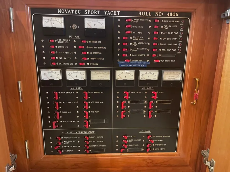 Slide: The Image of Electrical control panel of 2005 Novatec 48 Cockpit Motor Yacht, showing various switches and gauges. - 44
