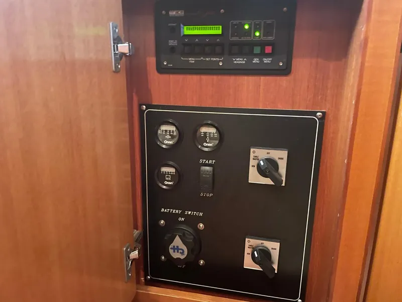 Slide: The Image of Control panel inside 2005 Novatec 48 Cockpit Motor Yacht, featuring switches and indicators. - 45