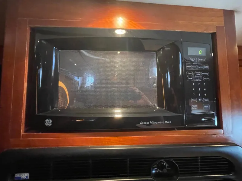 Slide: The Image of GE sensor microwave oven in 2005 Novatec 48 Cockpit Motor Yacht kitchen. - 50