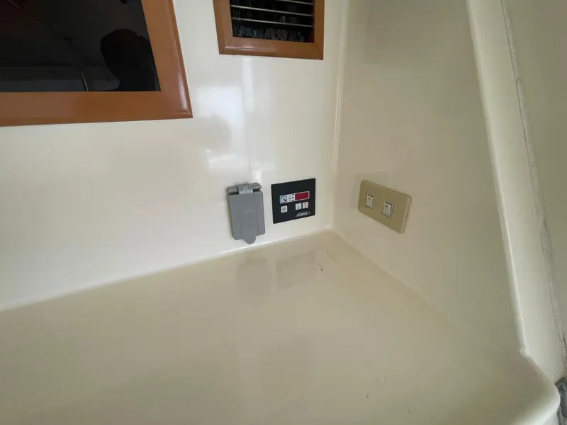 Slide: The Image of Control panel and switches on 2005 Novatec 48 Cockpit Motor Yacht interior. - 54