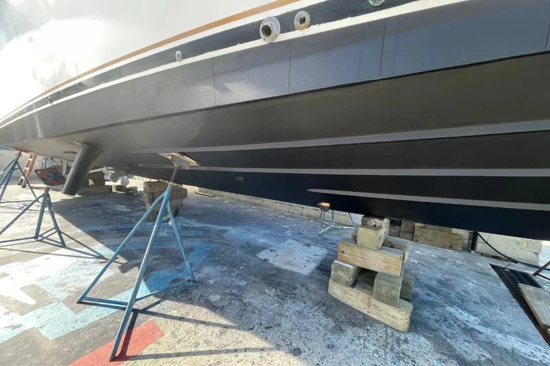 Slide: The Image of 2005 Novatec 48 Cockpit Motor Yacht hull on stands in a boatyard. - 76