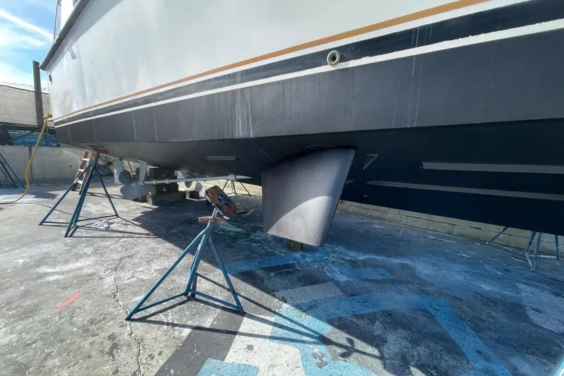 Slide: The Image of 2005 Novatec 48 Cockpit Motor Yacht on stands, showing hull and rudder details. - 77