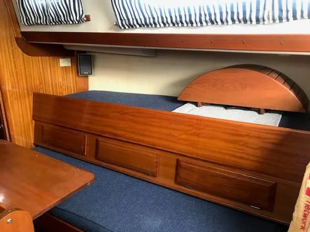 Slide: The Image of 1969 Chris-Craft Apache 37 interior with wooden cabinetry and blue upholstery. - 18