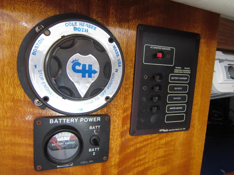 Slide: The Image of Control panel of a 1969 Chris-Craft Apache 37 boat, featuring battery and power switches. - 30