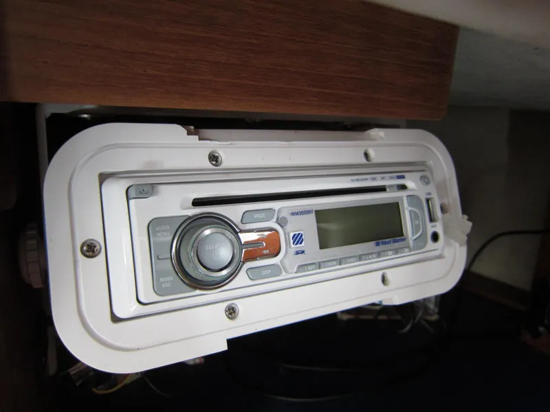 Slide: The Image of 1969 Chris-Craft Apache 37 stereo system with digital display and control knobs. - 31